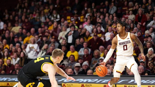 Elijah Hawkins dribbles